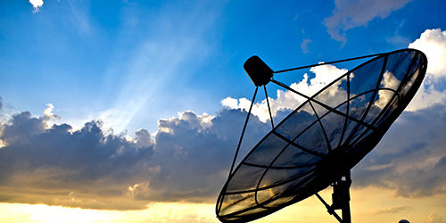 satellite dish silhoette on sunset background